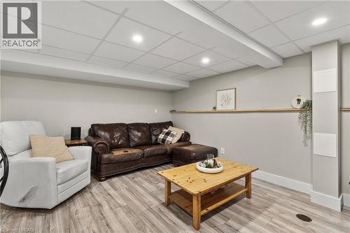Living area with a paneled ceiling, recessed lighting, and light wood-style flooring - 40 Bula Drive, St. Catharines, ON - Indoor Photo Showing Basement