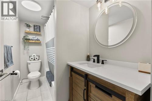 Bathroom with a shower with curtain, vanity, and light tile patterned floors - 40 Bula Drive, St. Catharines, ON - Indoor Photo Showing Bathroom