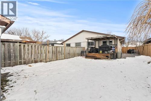 Snow covered house with a fenced backyard and a wooden deck - 40 Bula Drive, St. Catharines, ON - Outdoor With Exterior