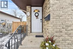 Doorway to property with stone siding - 