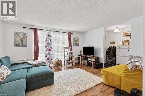 Living room with a textured ceiling and wood finished floors - 40 Bula Drive, St. Catharines, ON - Indoor Photo Showing Living Room