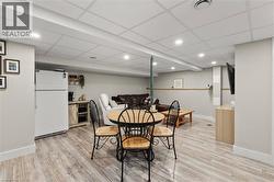 Dining space with recessed lighting and light wood-style floors - 