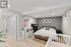 Bedroom featuring light wood finished floors and recessed lighting - 