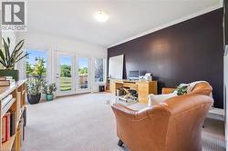 Office with crown molding and light carpet - 