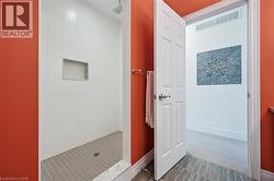 Bathroom with walk in shower and baseboards - 