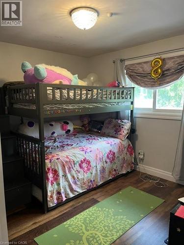 Bedroom with dark wood finished floors and baseboards - 235 Fearnwood Street, Cambridge, ON - Indoor Photo Showing Bedroom