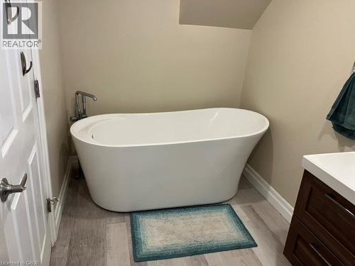 Full bathroom with vanity, a freestanding bath, and light wood-style flooring - 235 Fearnwood Street, Cambridge, ON - Indoor Photo Showing Bathroom