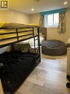 Bedroom featuring light wood finished floors and recessed lighting - 