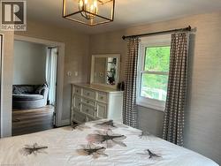 Bedroom with a chandelier - 