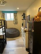 Bedroom featuring light wood-style floors and recessed lighting - 