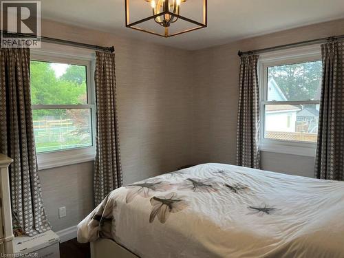 Bedroom featuring a chandelier and baseboards - 235 Fearnwood Street, Cambridge, ON - Indoor Photo Showing Bedroom