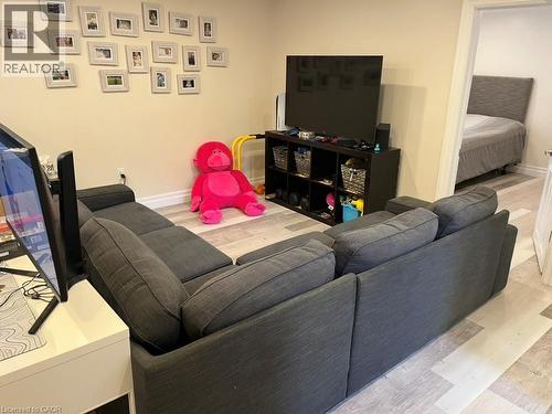 Living room with light wood finished floors and baseboards - 235 Fearnwood Street, Cambridge, ON - Indoor