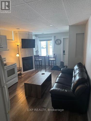 22 Beach Boulevard, Temiskaming Shores, ON - Indoor Photo Showing Living Room With Fireplace