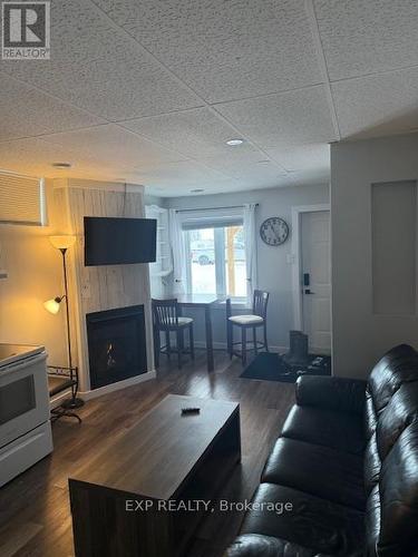 22 Beach Boulevard, Temiskaming Shores, ON - Indoor Photo Showing Living Room With Fireplace