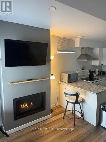 22 Beach Boulevard, Temiskaming Shores, ON - Indoor With Fireplace