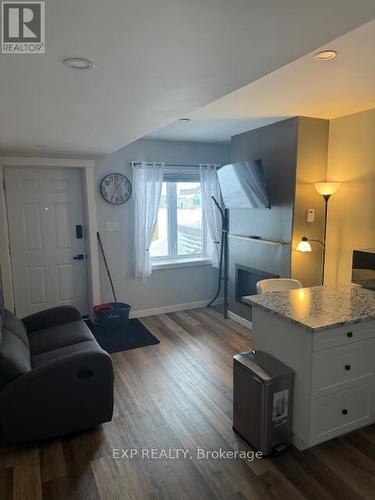 22 Beach Boulevard, Temiskaming Shores, ON - Indoor Photo Showing Living Room With Fireplace