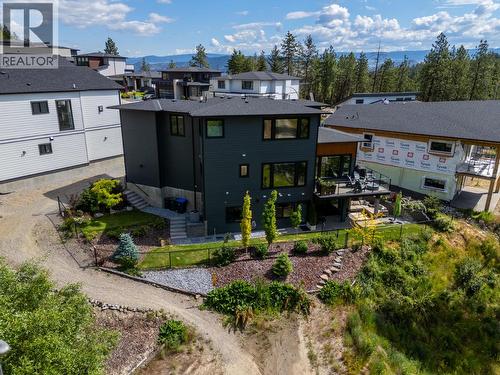 Back of home with deck, yard space backing onto private park space. - 830 Westview Way Unit# 22, West Kelowna, BC - Outdoor