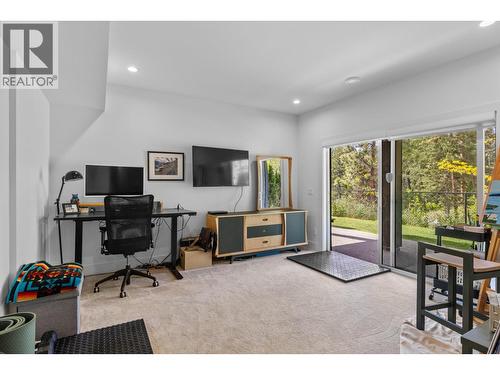 Lower level rec room with access to yard. - 830 Westview Way Unit# 22, West Kelowna, BC - Indoor