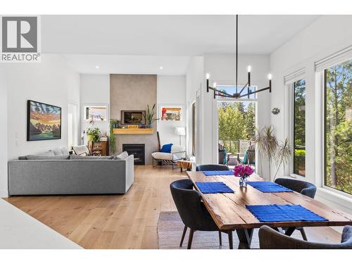 Open dining and living room - 830 Westview Way Unit# 22, West Kelowna, BC - Indoor With Fireplace