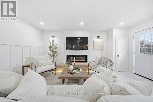 11 Garside Avenue S, Hamilton, ON - Indoor Photo Showing Living Room With Fireplace