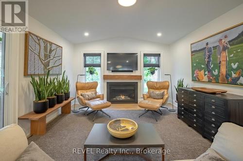 rear sitting room with gas fireplace - 74 Montgomery Road, Welland (N. Welland), ON - Indoor Photo Showing Living Room With Fireplace