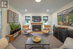 rear sitting room with gas fireplace - 