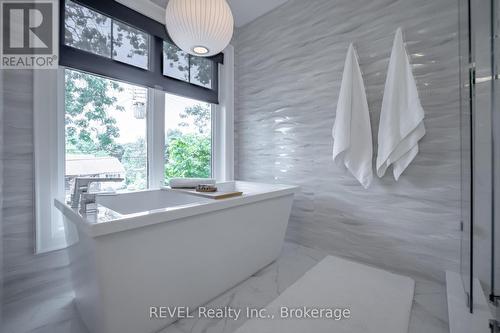 elegant primary ensuite with soaker tub - 74 Montgomery Road, Welland (N. Welland), ON - Indoor Photo Showing Other Room