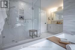 primary ensuite with walk in shower and tub - 