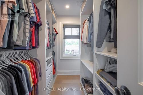 large walk in closet in primary suite w built ins - 74 Montgomery Road, Welland (N. Welland), ON - Indoor With Storage