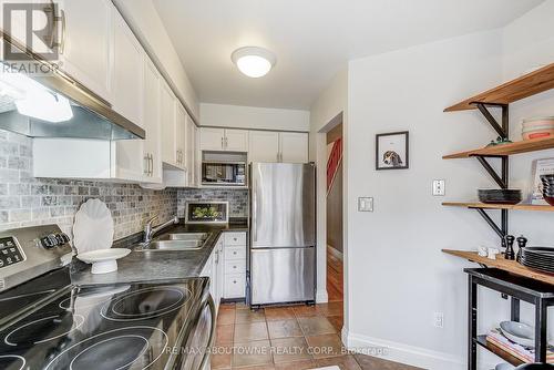 418 - 895 Maple Avenue, Burlington, ON - Indoor Photo Showing Kitchen With Stainless Steel Kitchen With Double Sink