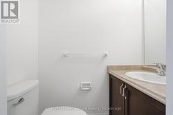 2 piece washroom off foyer with tile flrs & vanity - 