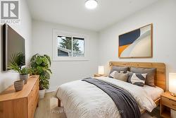 Virtually Staged Bedroom 2; laminate flrs & closet - 