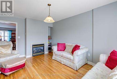 21 Polarlights Way, Toronto, ON - Indoor Photo Showing Living Room With Fireplace