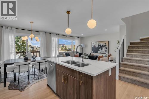 140 155 Mcfaull Way, Saskatoon, SK - Indoor Photo Showing Kitchen With Double Sink