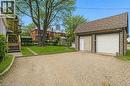 Detached two-car garage with stone-effect siding and shingle roof - 260 Prospect Street S, Hamilton, ON  - Outdoor 