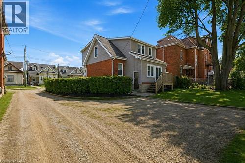 Two-story residence featuring a brick and siding exterior with multiple windows - 260 Prospect Street S, Hamilton, ON - Outdoor With Facade