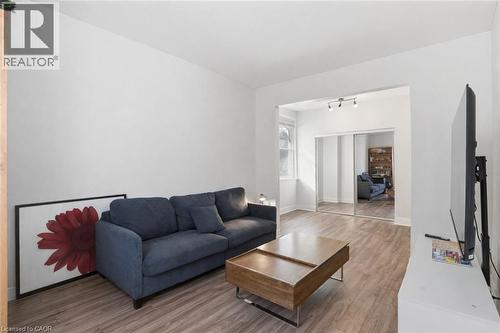 Living area featuring wood finished floors and baseboards - 260 Prospect Street S, Hamilton, ON - Indoor Photo Showing Living Room
