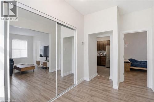 Hall featuring light wood finished floors and baseboards - 260 Prospect Street S, Hamilton, ON - Indoor Photo Showing Other Room