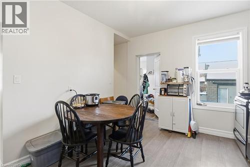 Dining area with baseboards and light wood-style floors - 260 Prospect Street S, Hamilton, ON - Indoor Photo Showing Dining Room