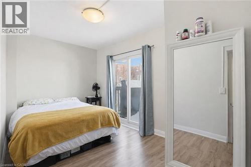 Bedroom featuring light wood finished floors and baseboards - 260 Prospect Street S, Hamilton, ON - Indoor Photo Showing Bedroom