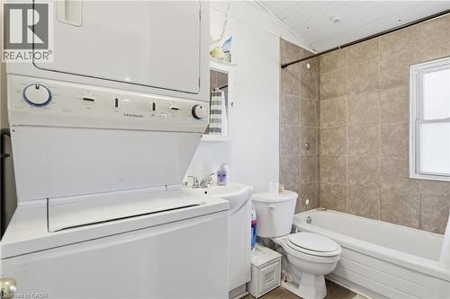 Bathroom with shower / bath combination, vanity, and stacked washer and dryer - 260 Prospect Street S, Hamilton, ON - Indoor Photo Showing Laundry Room