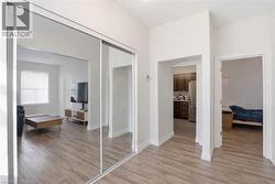 Hall featuring light wood finished floors and baseboards - 