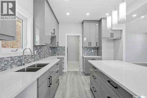 142 Sharma Lane, Saskatoon, SK - Indoor Photo Showing Kitchen With Double Sink With Upgraded Kitchen