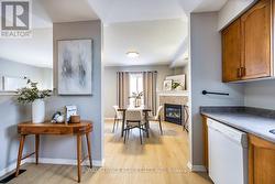 Kitchen overlooks living room and dining room. - 