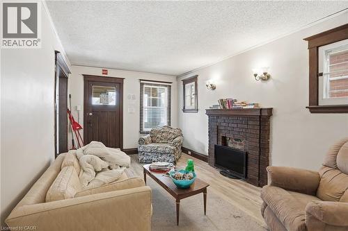 67 Sterling Street, Hamilton, ON - Indoor Photo Showing Living Room With Fireplace