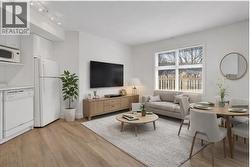 Virtually staged with pull out couch. - 