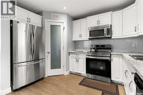 5113 Crane Crescent, Regina, SK - Indoor Photo Showing Kitchen With Stainless Steel Kitchen With Double Sink