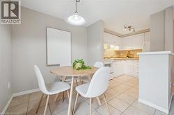 Dining space featuring light tile patterned floors - 