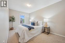 Bedroom with baseboards and carpet floors - 