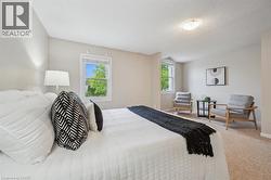 Carpeted bedroom with baseboards and a textured ceiling - 